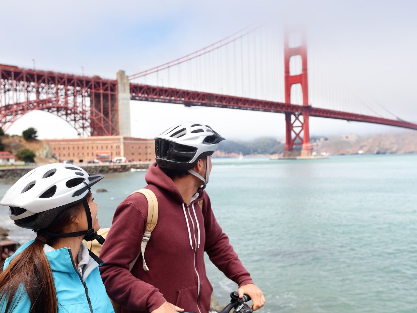 Couple looking at Golden Gate Bridge near The Garrett Hotel