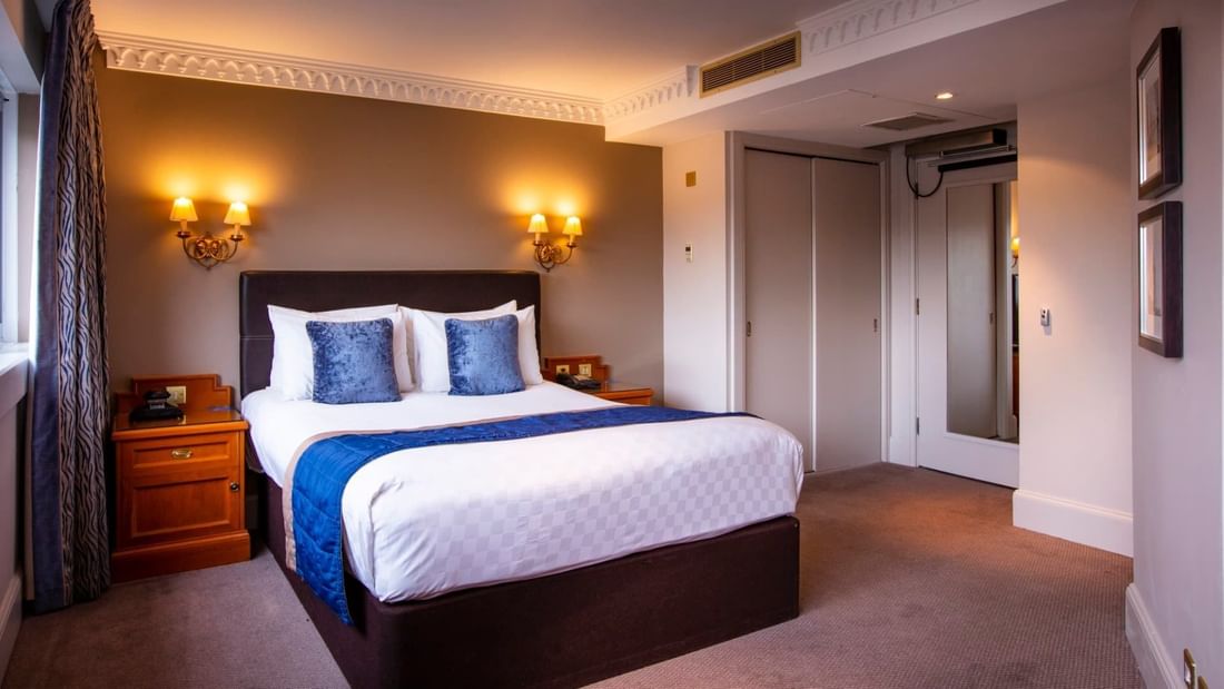 Cozy bed in Accessible Double Room at Clermont Hotel Group