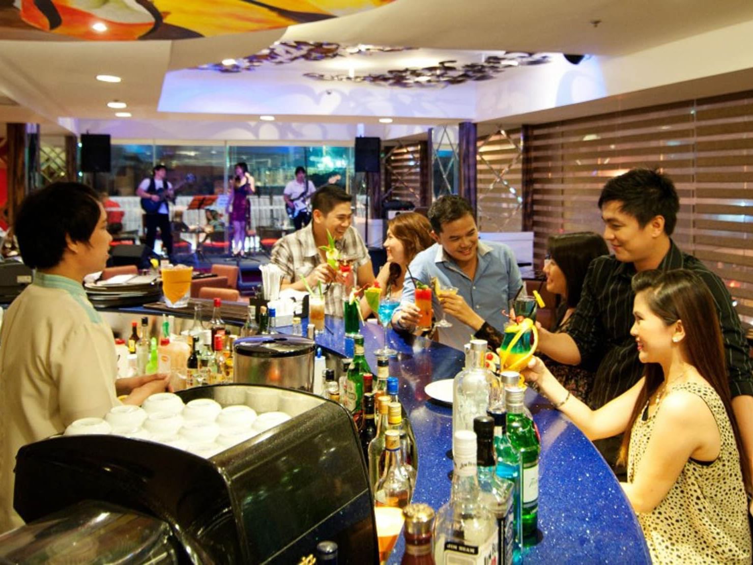People enjoying drinks in Annex Bar Lounge at St Giles Makati