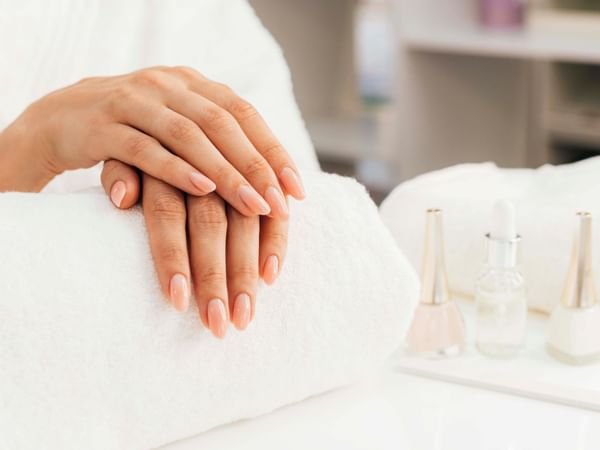 A woman receiving a manicure at the Spa in Manteo Resort