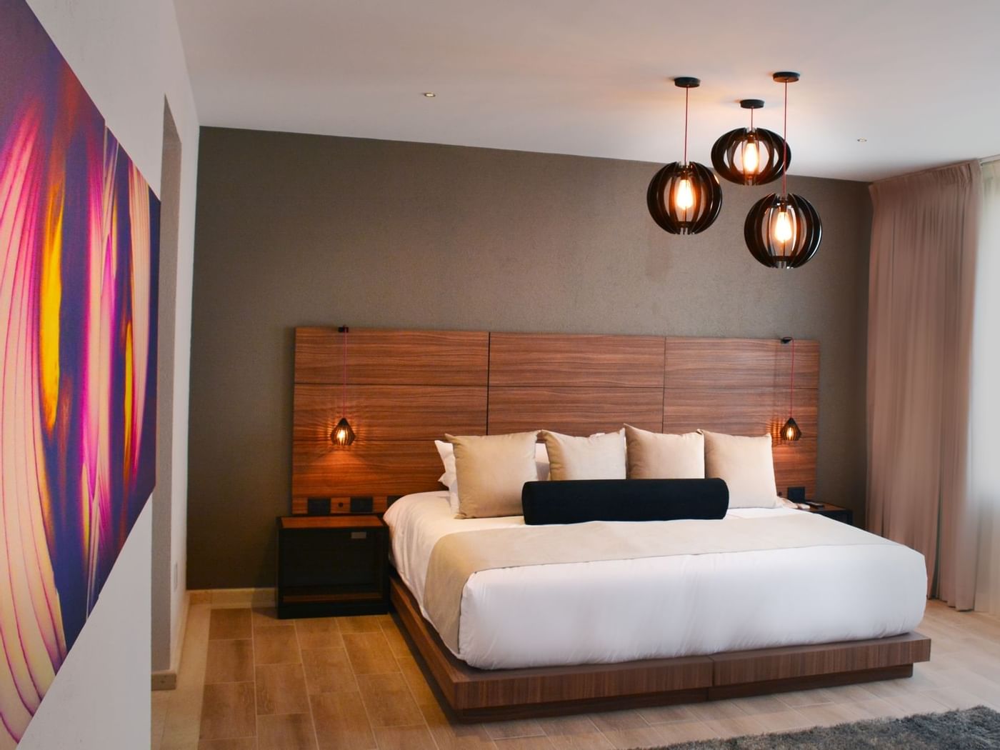 King bed in Standard Bedroom at Curamoria Collection