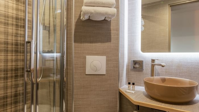 Bathroom vanity in bedrooms at Hotel Orleans North