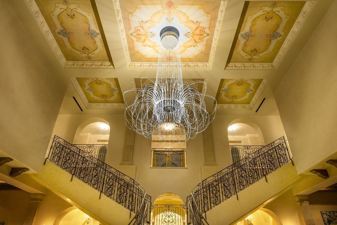 Allegretto's two story lobby with painted ceilings and split sta