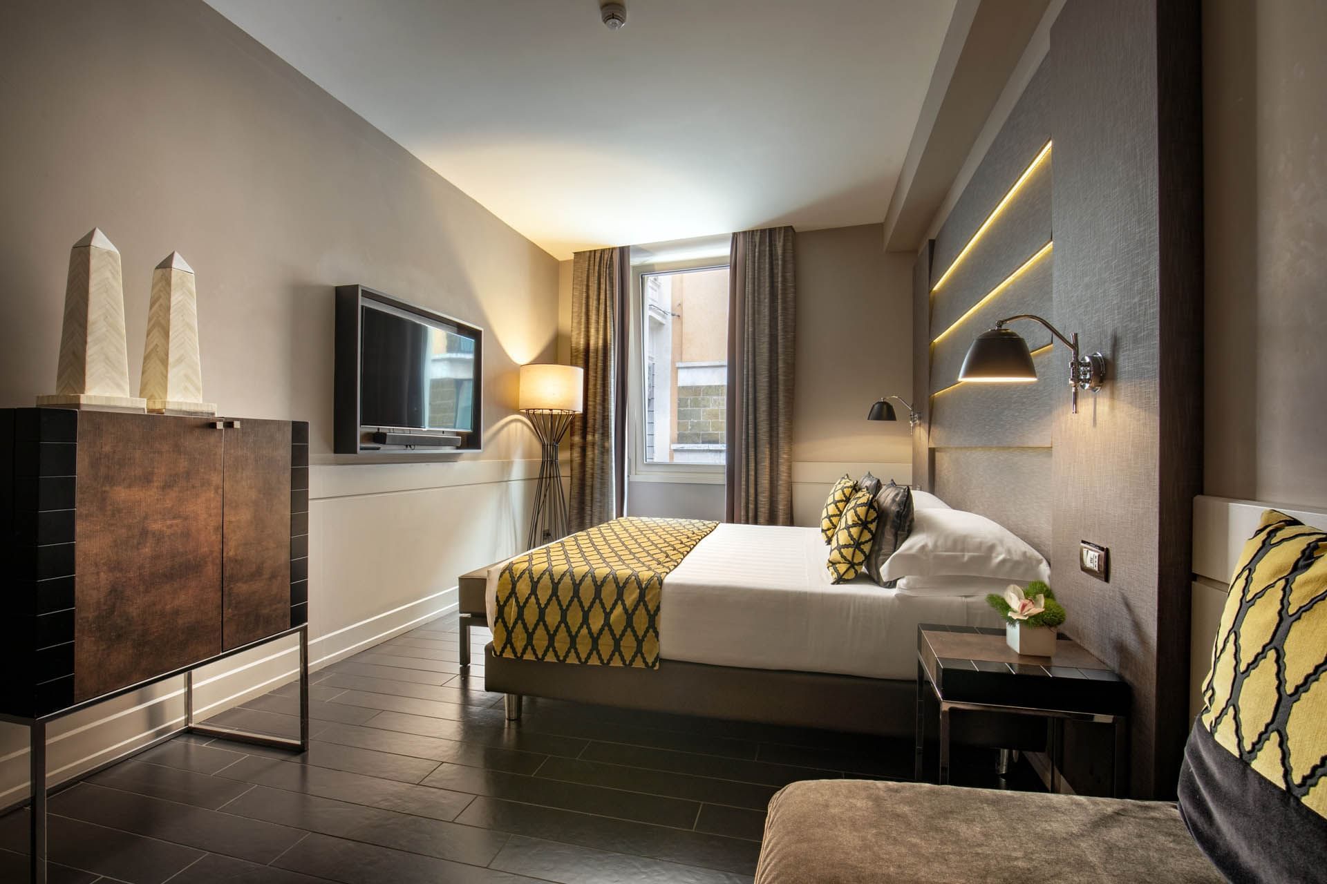 Deluxe Room with a luxury interior featuring the modern furniture and warm lighting at The Style