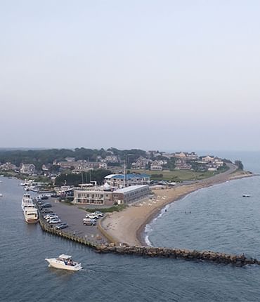 Aerial view of ferries parked by the dock near Falmouth Tides