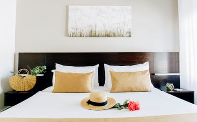 Interior of a room with a king bed at Casa Boutique Hotel