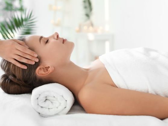 Lady having a head massage treatment in the Spa at Ana Hotels