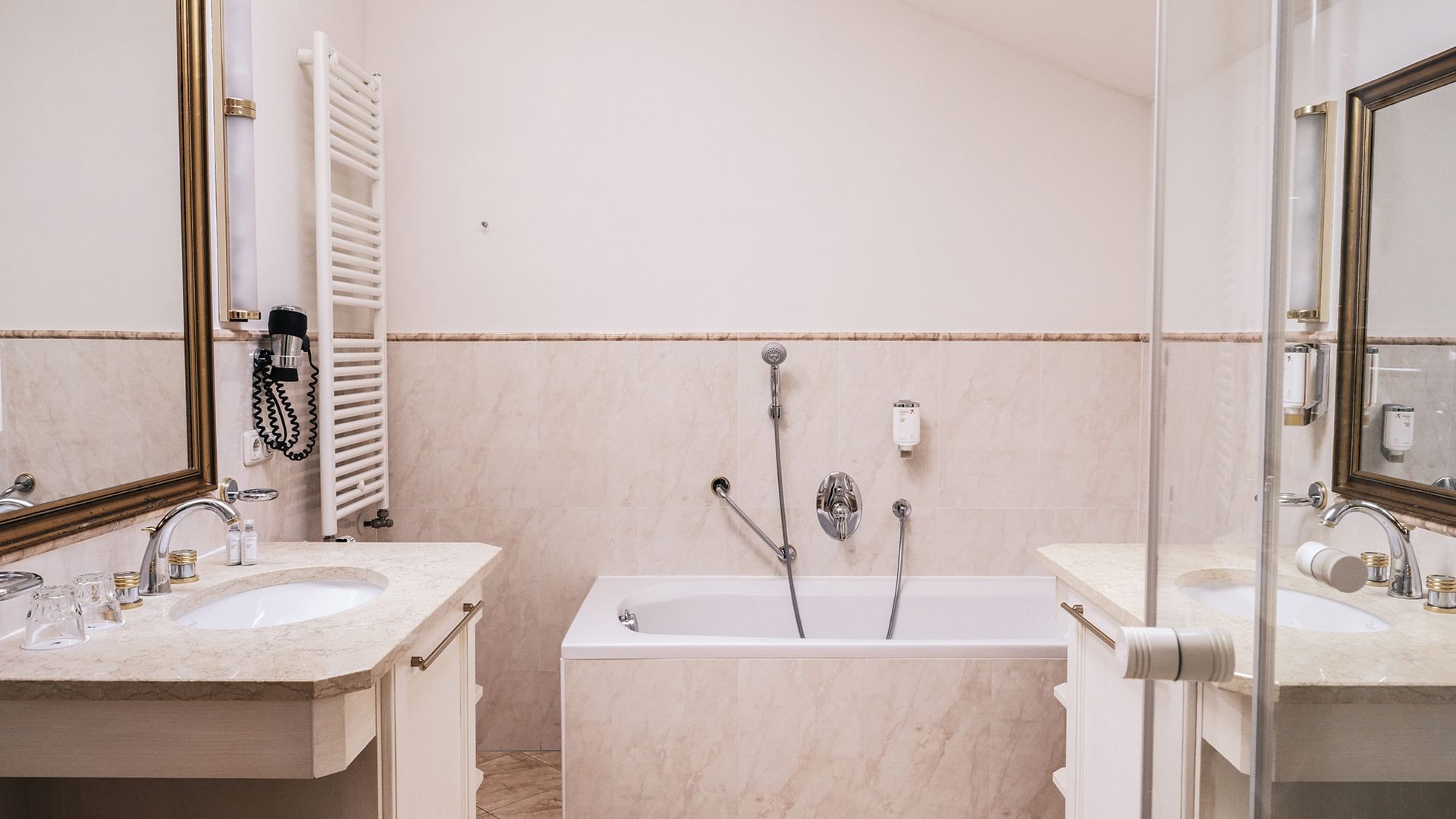 Bathroom tub & vanity Family Maisonette at Falkensteiner Hotels