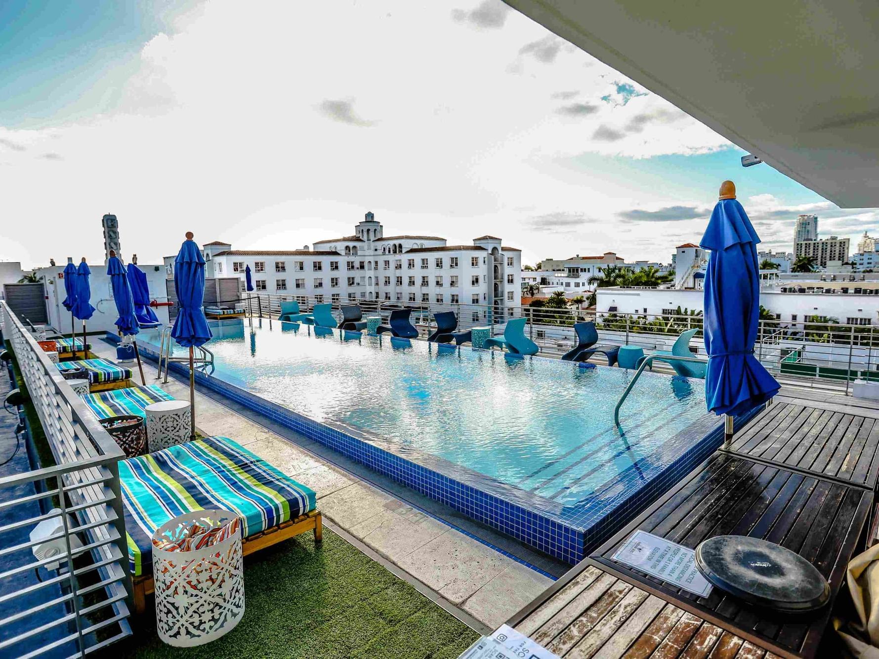 Rooftop Pool with sun loungers and sun huts at Fairwind Hotel Miami
