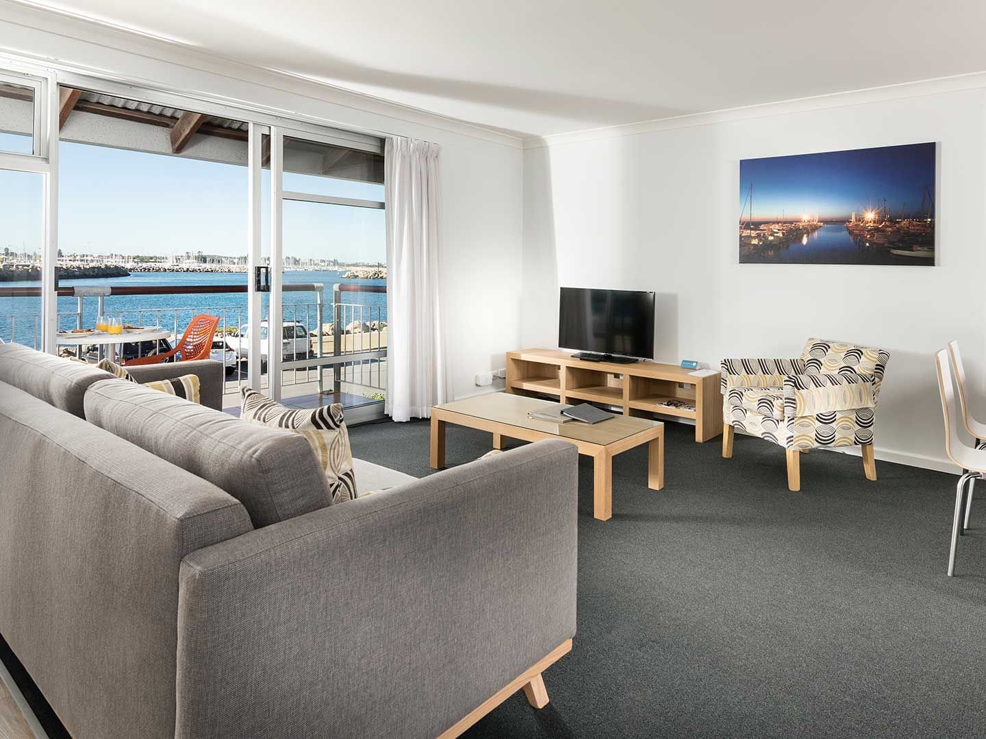 Living area in 1 Bedroom Harbour Sunrise apartment at Be Fremantle