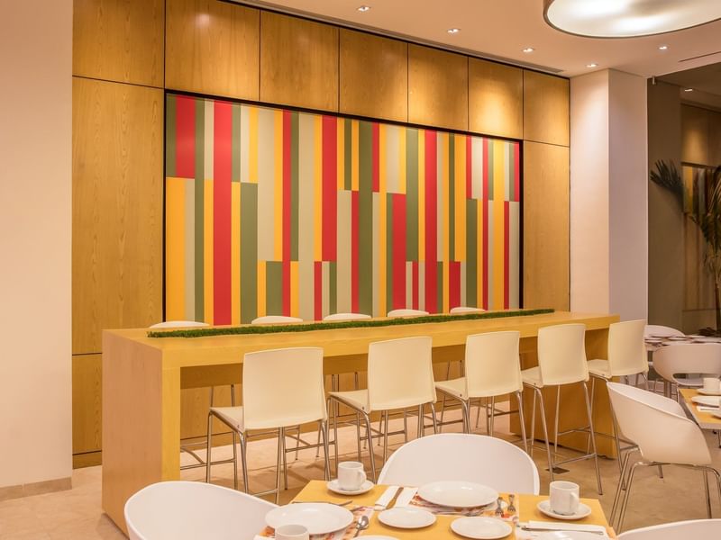 Restaurant with cutlery, chairs & tables at Fiesta Inn Hotels