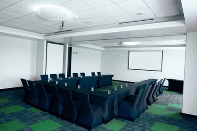 Green Room with U-shape table, chairs and screen at D Sabana Hotel, San Jose Costa Rica Hotel