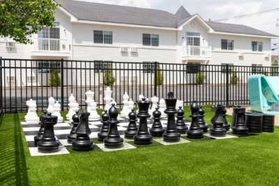Outdoor recreational activity with giant chess at Driftaway Hotel and Pool