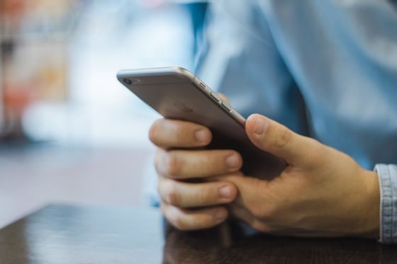 Close-up of using a phone at Miami Lakes Hotel