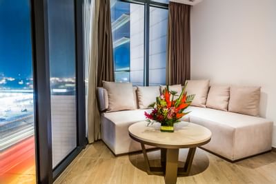 Sofa next to a window with city views