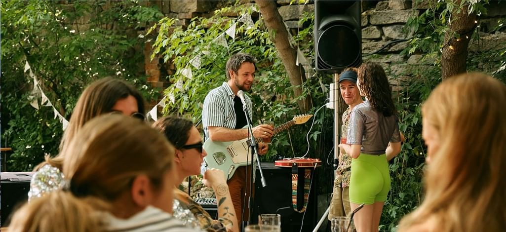 A band takes a song request at an outdoor patio in Canmore.