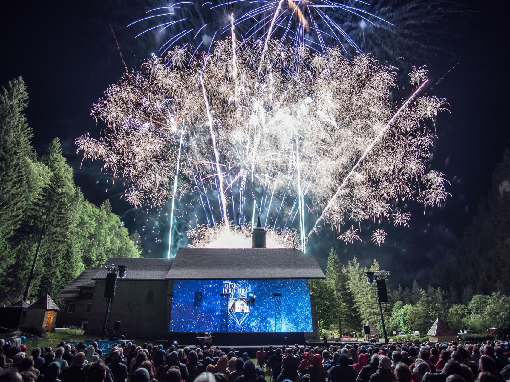 Fireworks in the sky at a musical show near Originals Hotels