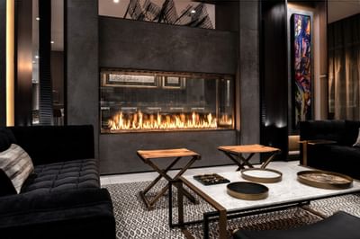 Lounge area with a fireplace in The Portsmouth Collection