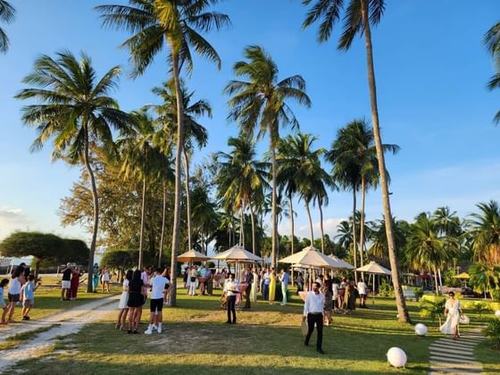 People gathered for an event outdoors at Pelangi Beach Resort