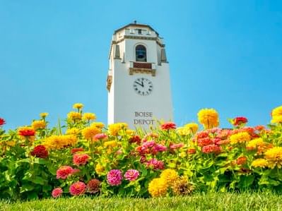 Flower garden with the Boise Deposit Clock Tower at Hotel 43