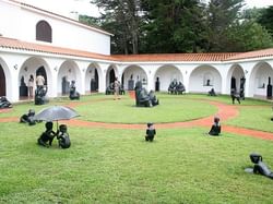 Statues in the garden at Museo Ralli near Grand Hotels Lux