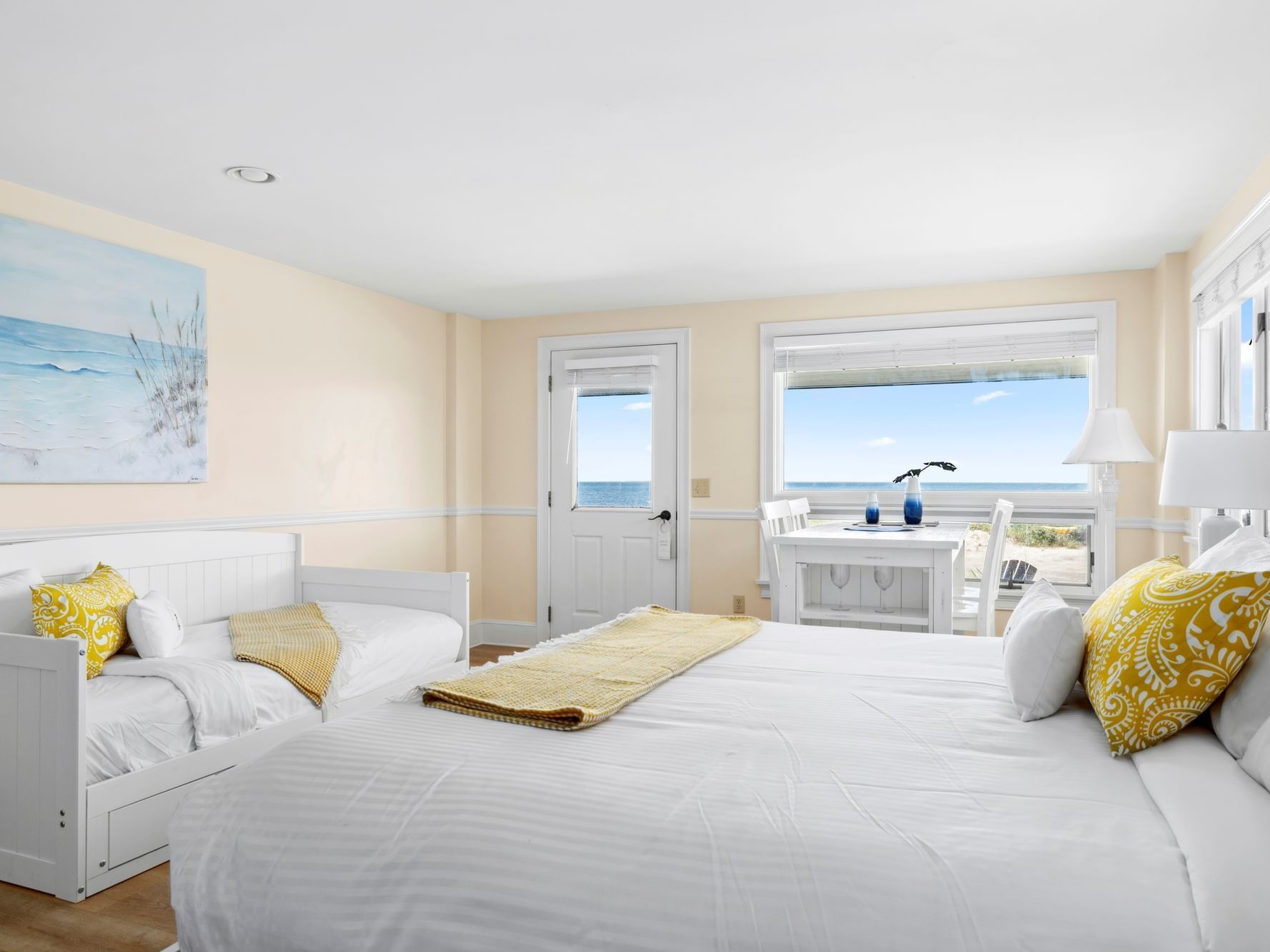 Dining table & daybed by the king bed in Suntide Oceanfront King at Chatham Tides Resor