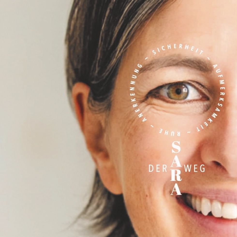 Smiling woman with book title overlay in German, 