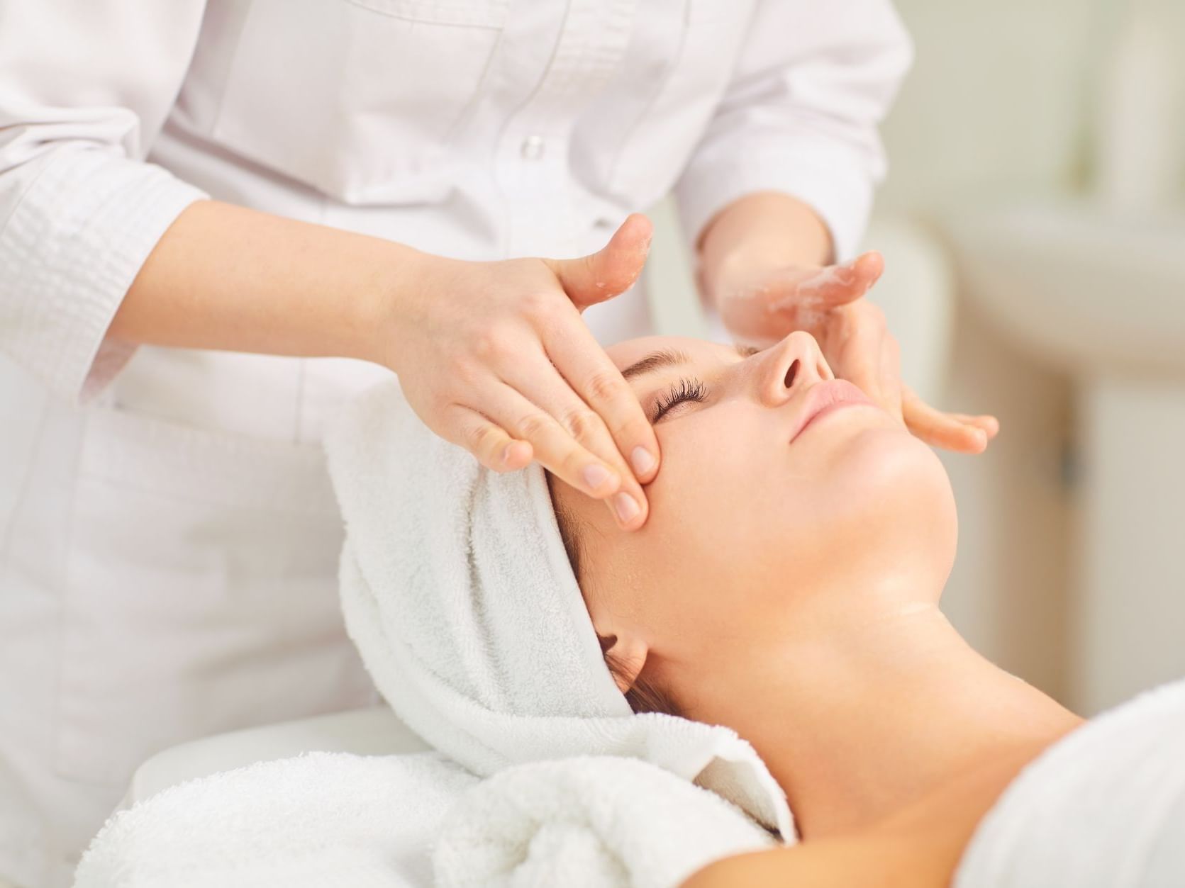 Close-up of woman having a facial at Ana Hotels