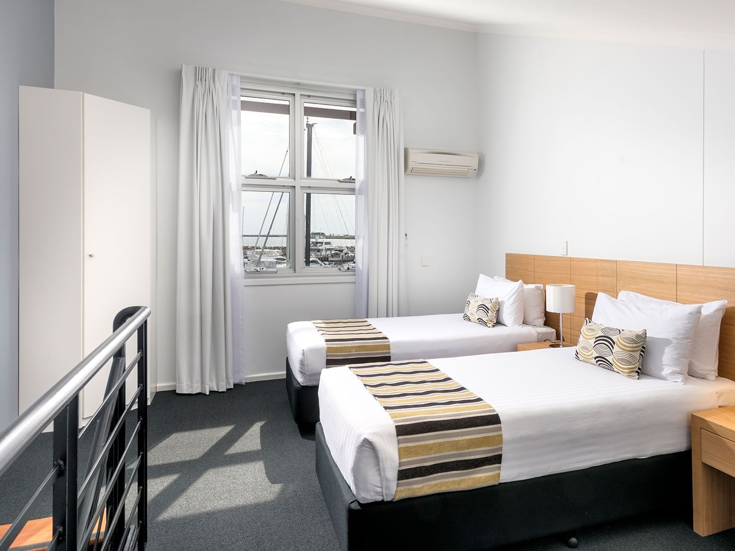 Bedroom with two beds in 3 Bedroom Ocean Sunset Spa apartment at Be Fremantle