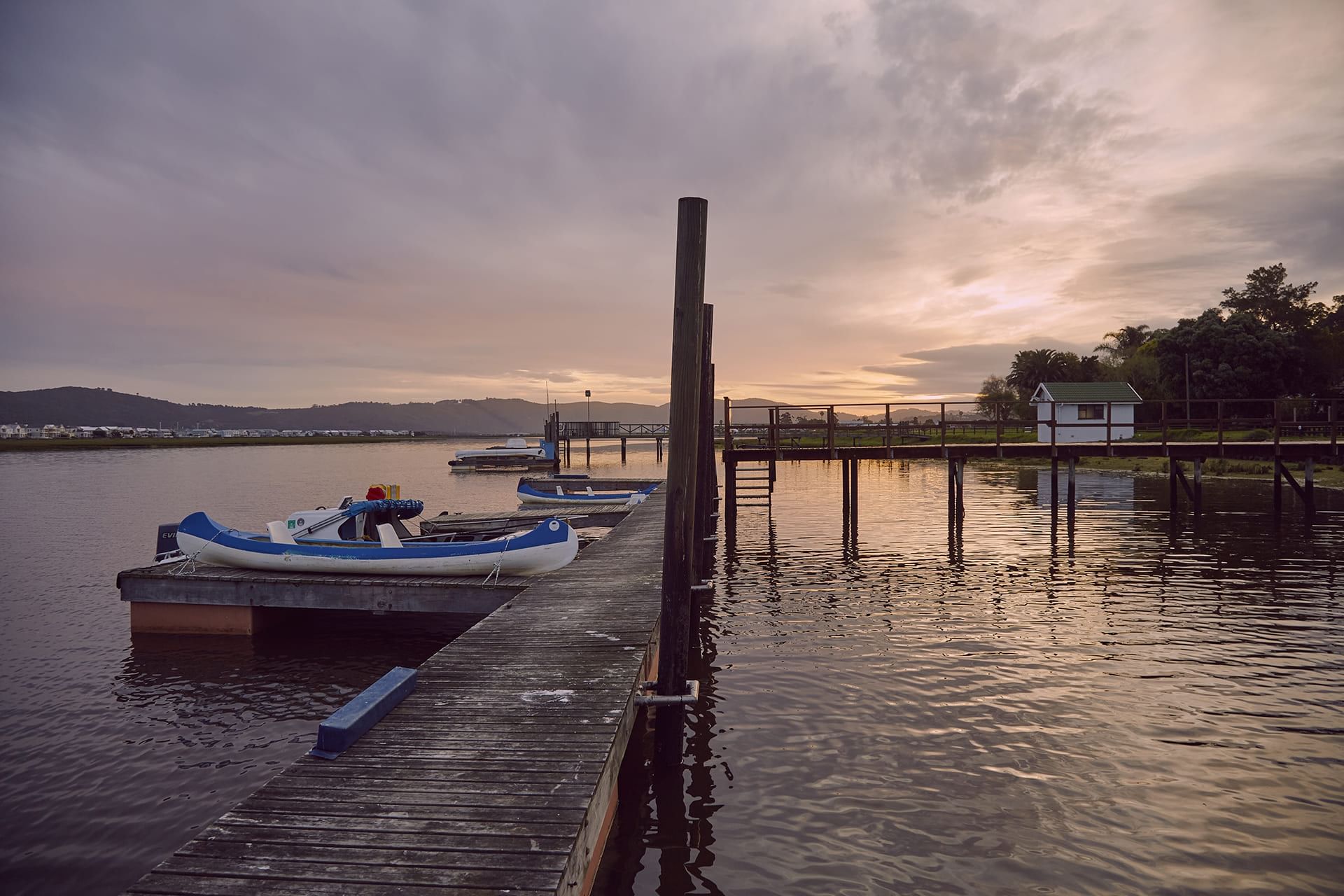 Boats docked at the Pier by the lake near Knysna River Club