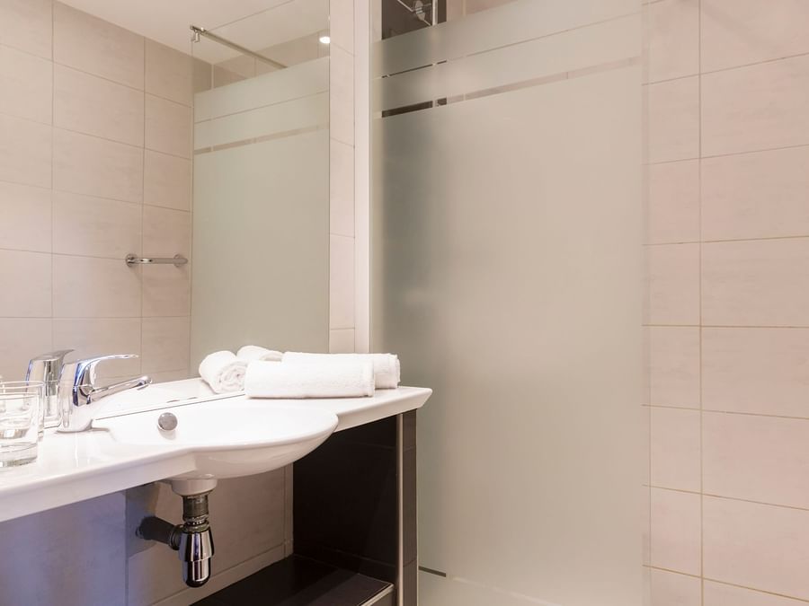 Bathroom vanity in bedrooms at Hotel Aquilon