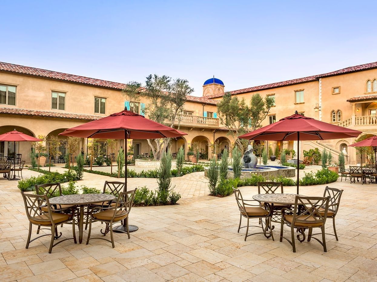 Tables and umbrellas in courtyard