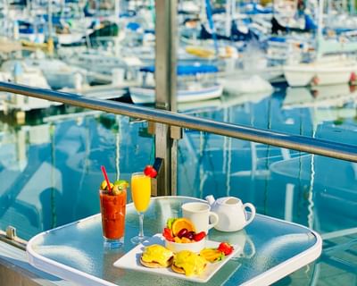Eggs benedict & bloody Mary on the patio at Bay Club Hotel