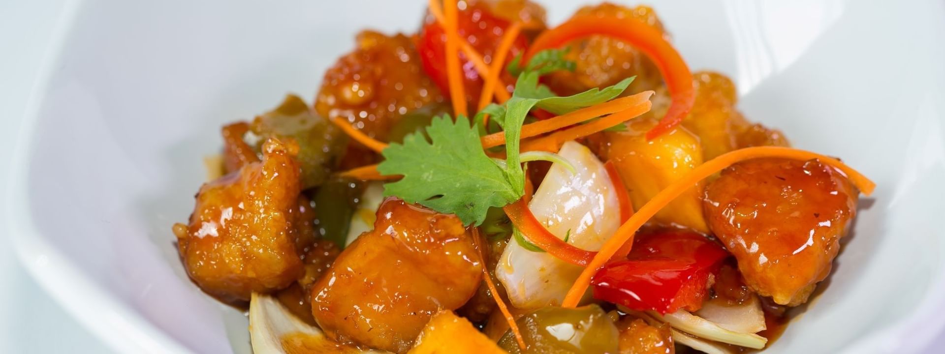 Glazed chicken pieces with bell peppers and onions in Tings on a Stick at Warwick Paradise Island Bahamas