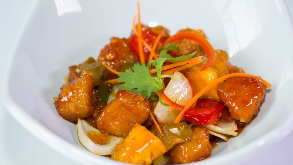 Glazed chicken pieces with bell peppers and onions in Tings on a Stick at Warwick Paradise Island Bahamas