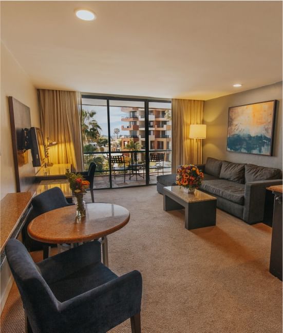 Dining table & lounge area in a Room at Hotel Coral y Marina