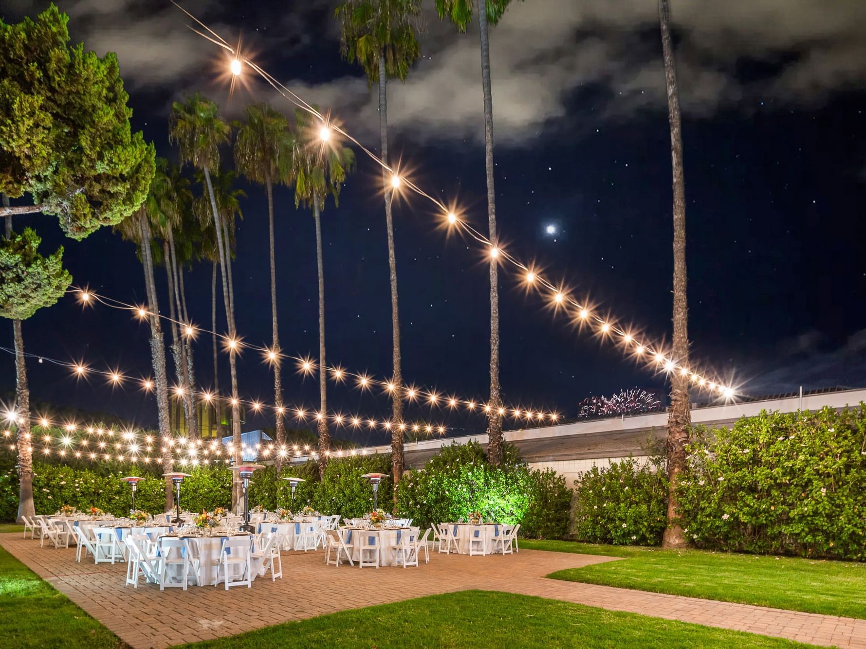 Veranda at night with bistro lights at The Anaheim Hotel