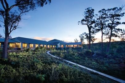 Exterior view of the Cradle Mountain Hotel & evening sky