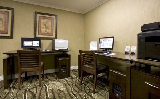 office with desks, computers and printers