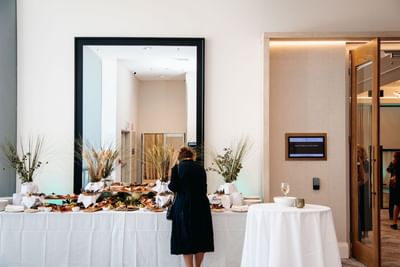 Lady having food in the buffet arranged at Amora Hotel Group