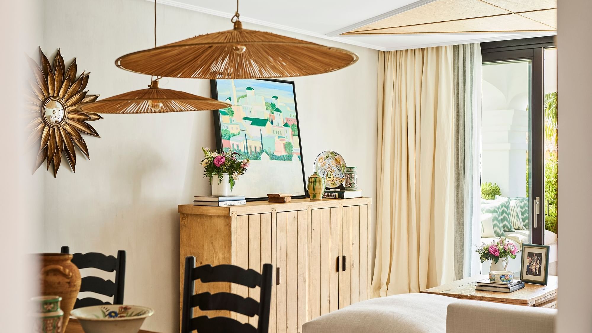 Santa Margarita 2-Bedroom Suite with straw ceiling panels and pendant lights over wood cabinet at Marbella Club