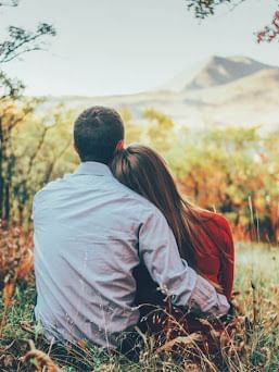 Couple overlooking the Pennsylvania mountains from a view point near Cove Pocono Resorts
