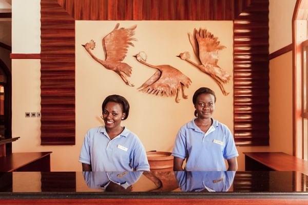 Two receptionists at Lake Victoria Serena Resort & Spa