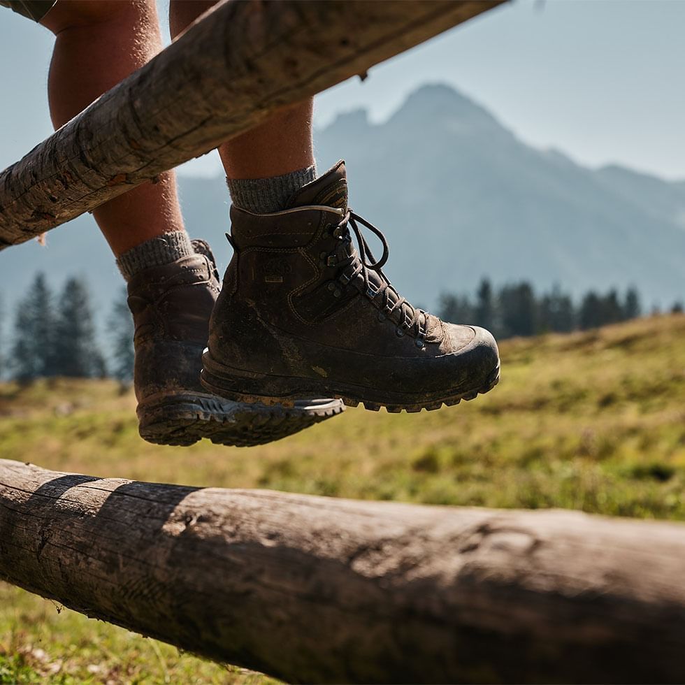 Close-up of hiker's feet with boots near Falkensteiner Hotels