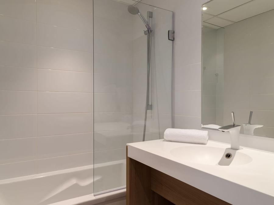 Bathroom vanity in bedrooms at Hotel Neptune