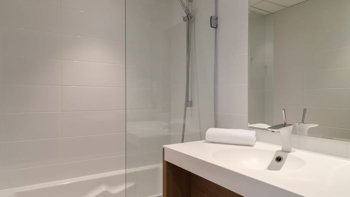 Bathroom vanity in bedrooms at Hotel Neptune