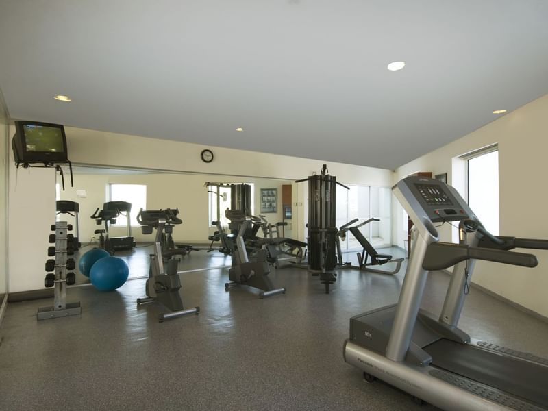 Exercise machines & Tv in a Gym Wellness Center at Fiesta Inn