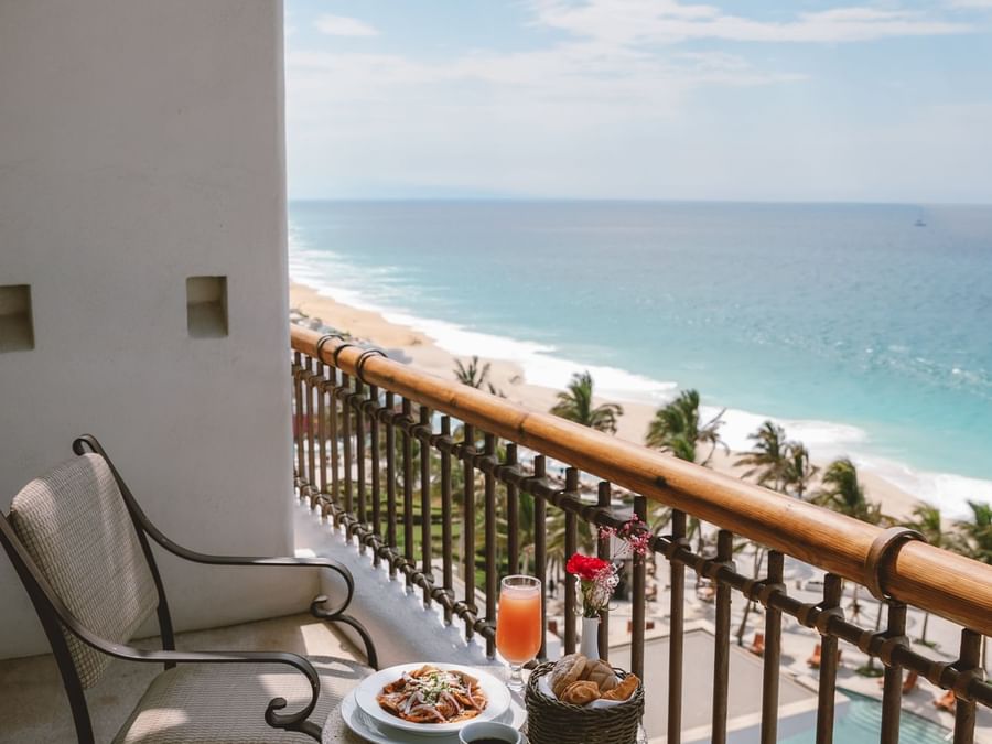 Ocean view from a private balcony in Junior Suite Ocean View at Marquis Los Cabos Resort with a table set for a breakfast