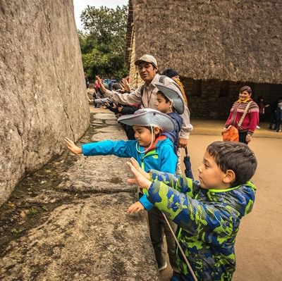 Tourists exploring at Machu Picchu near Hotel Sumaq 