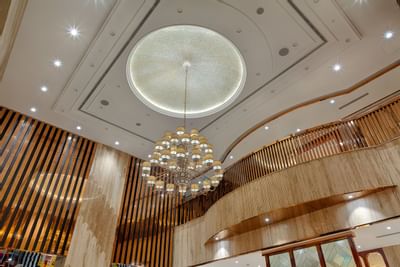 Luxurious hotel lobby with grand chandelier